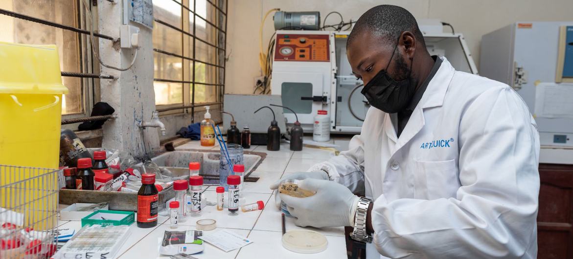 A doctor reviews a sample at a microbiology laboratory in a teaching hospital in Nigeria. A doctor reviews a sample at a microbiology laboratory in a teaching hospital in Nigeria.