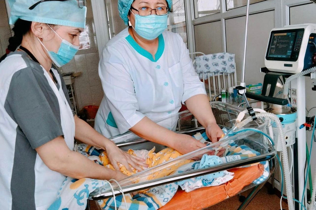 Doctors check the condition of a newborn baby who needs medical assistance at a hospital in Kazakhstan. Doctors check the condition of a newborn baby who needs medical assistance at a hospital in Kazakhstan.